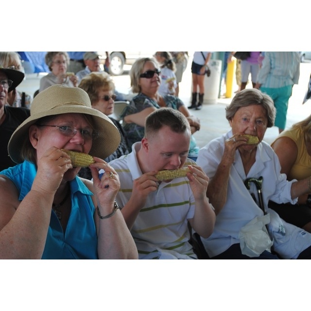 Gene Burt Davis, Jacob Davis, and Aunt Gene Johnson enjoy some delicious corn!